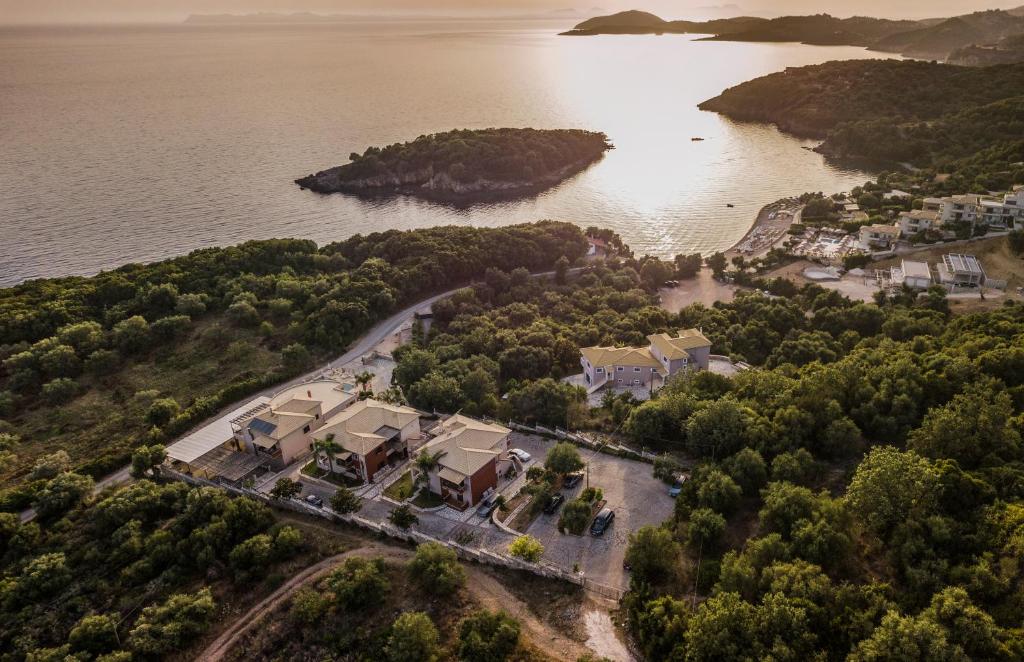 an aerial view of a home next to the water at 3Aktes Suites & Studios in Syvota