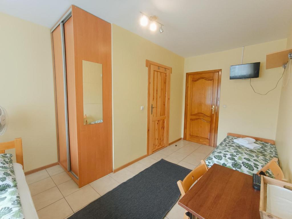 Postel nebo postele na pokoji v ubytování Dom Gościnny Piotr