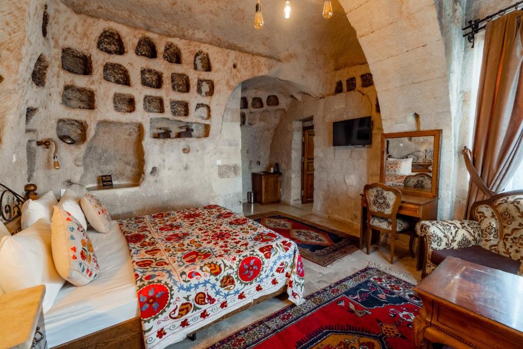 Postel nebo postele na pokoji v ubytování Amber Cave Suites