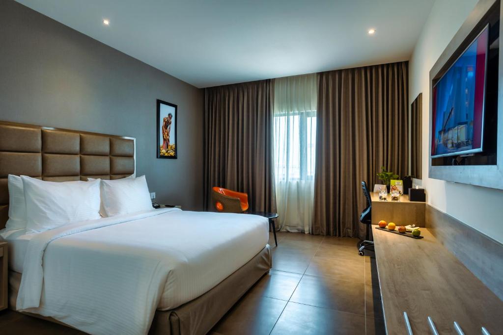 Postel nebo postele na pokoji v ubytování Amika Hotel,Madurai - Near Airport