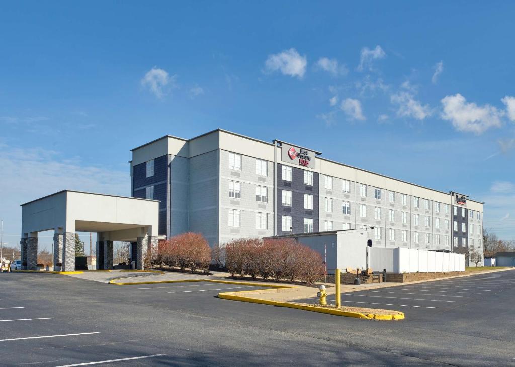a large building with a parking lot in front of it at Best Western Plus Executive Residency Pottstown in Pottstown
