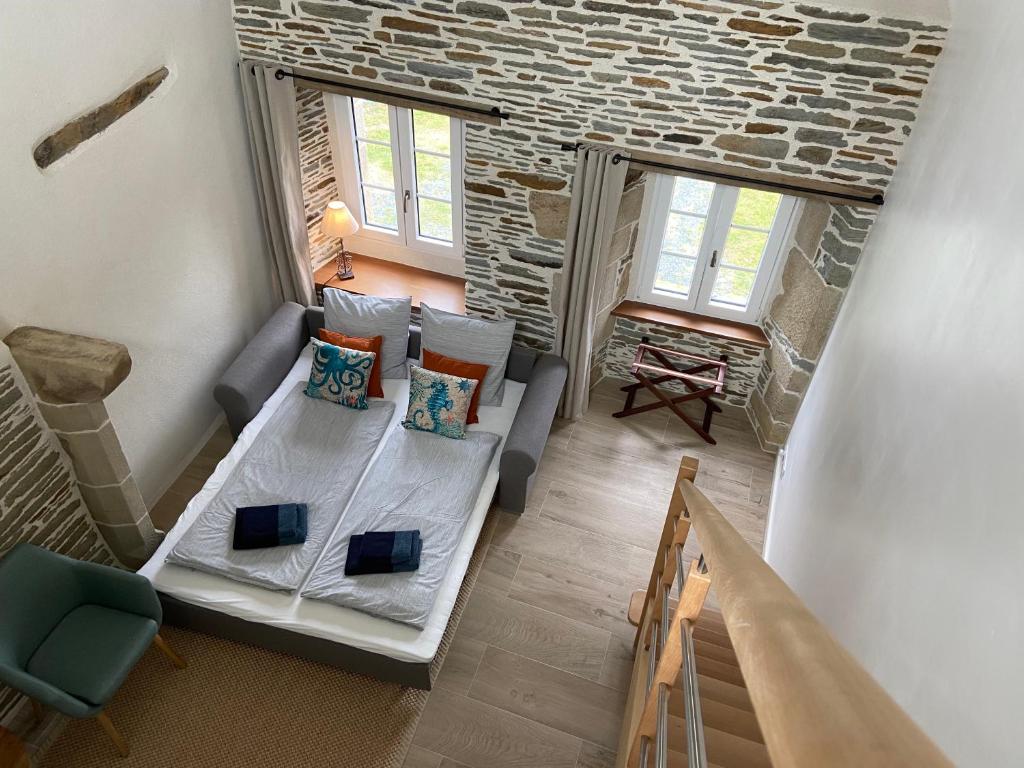 Postel nebo postele na pokoji v ubytování Domaine de Kerdavid - Chambres d'hôtes à Remungol