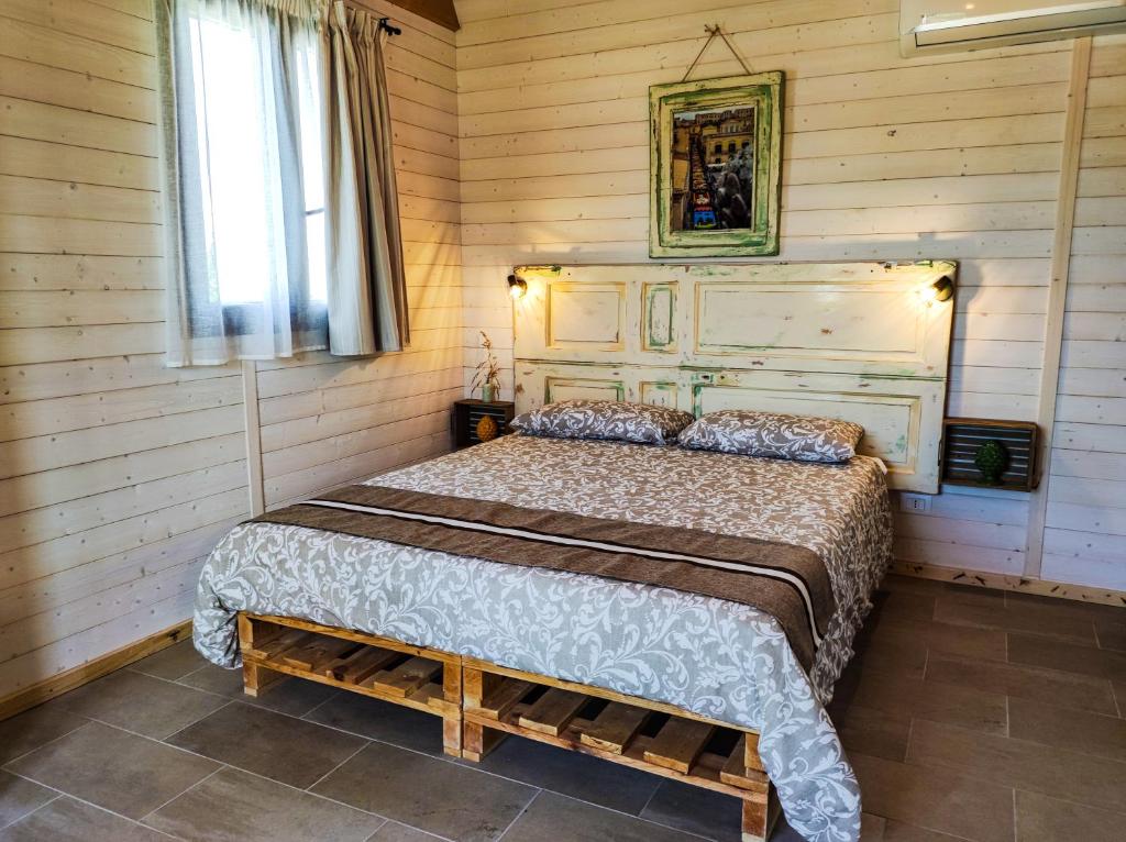 Postel nebo postele na pokoji v ubytování AgriBarocco