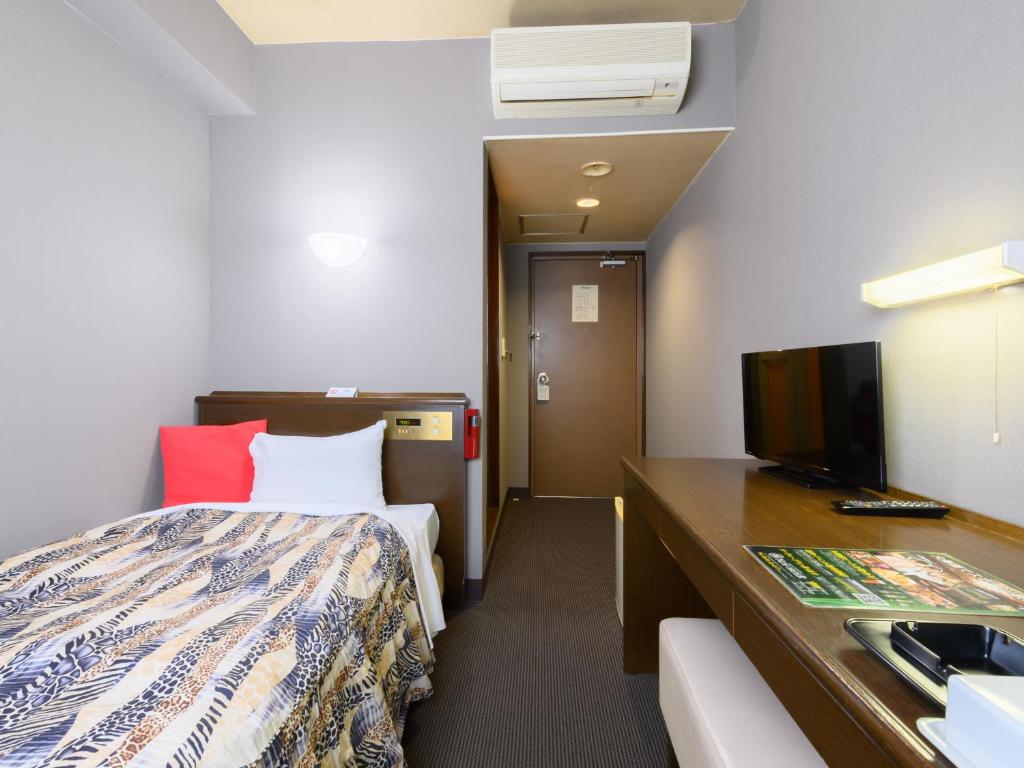 TV a/nebo společenská místnost v ubytování Tabist IWATA Station Hotel