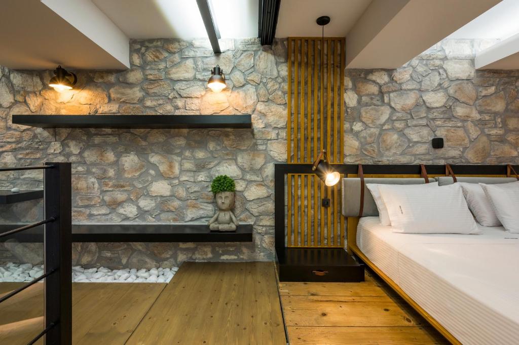 A bed or beds in a room at Skins Concept Boutique Apartment