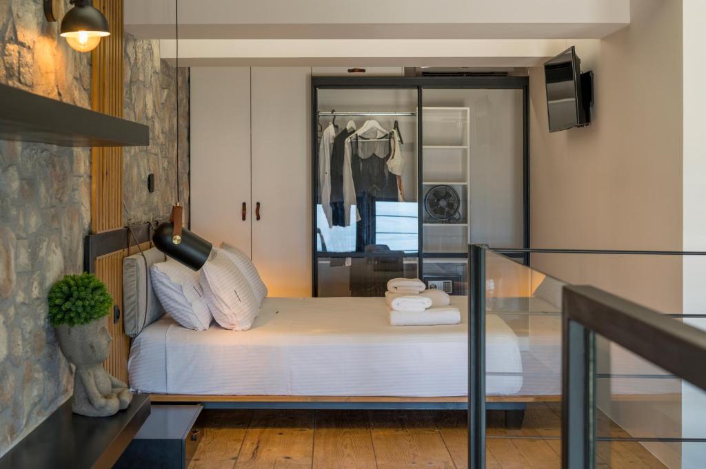 A bed or beds in a room at Skins Concept Boutique Apartment