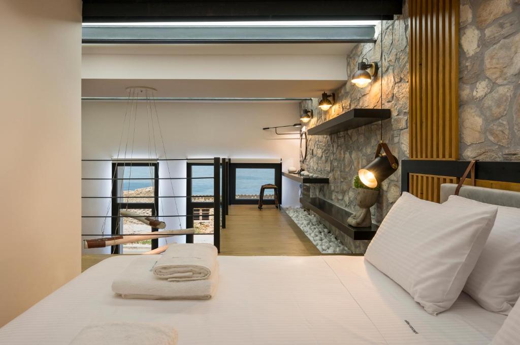 A bed or beds in a room at Skins Concept Boutique Apartment