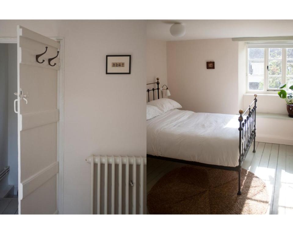 a bedroom with a bed and a radiator next to a window at Highday House - A Place To Escape To in Totnes