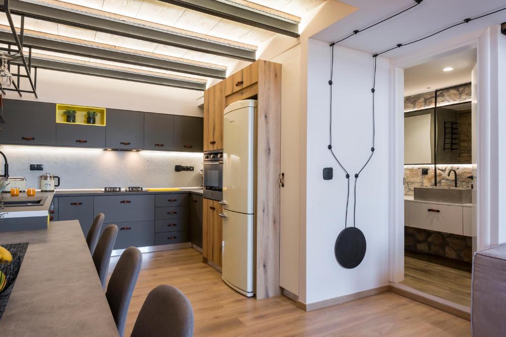 A kitchen or kitchenette at Skins Concept Boutique Apartment