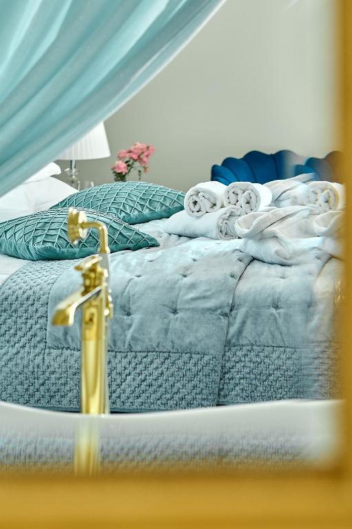 Postel nebo postele na pokoji v ubytování La Rose Residence