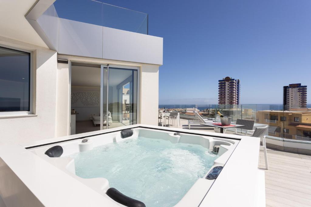 a hot tub on the roof of a building at Deluxe Apartment in Costa Adeje in Adeje