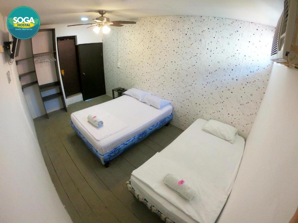 Postel nebo postele na pokoji v ubytování Soga Hostal