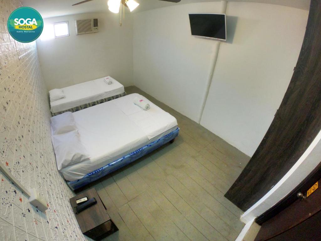 Postel nebo postele na pokoji v ubytování Soga Hostal