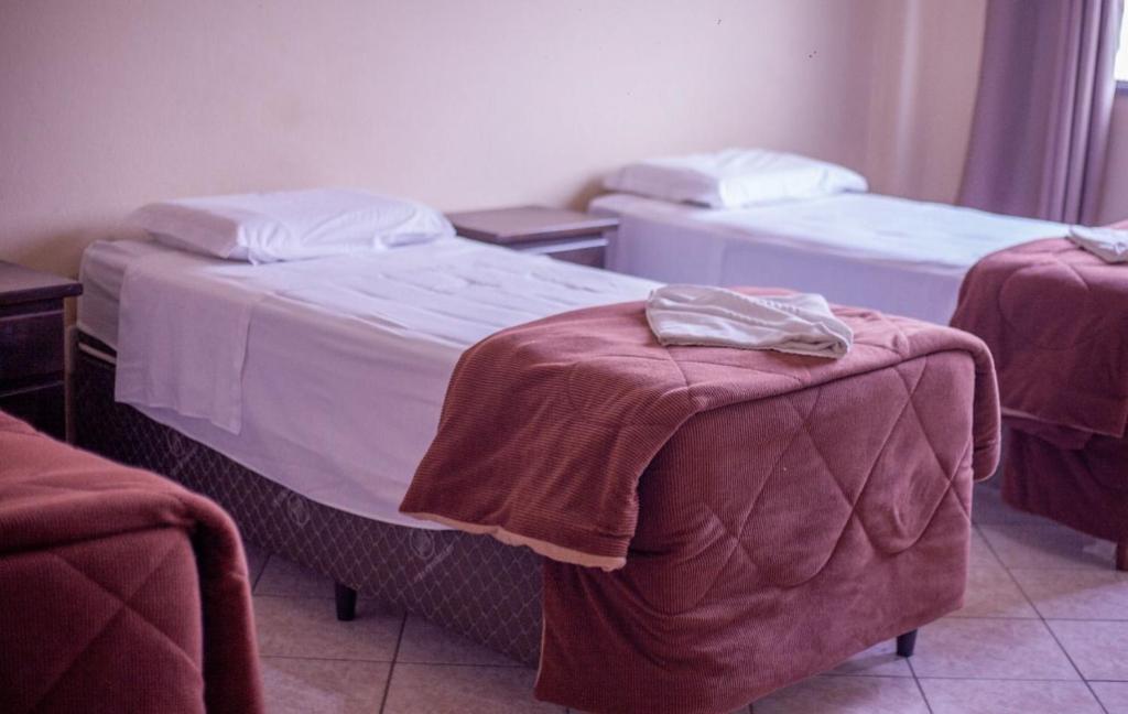 Postel nebo postele na pokoji v ubytování Hotel Ermitage