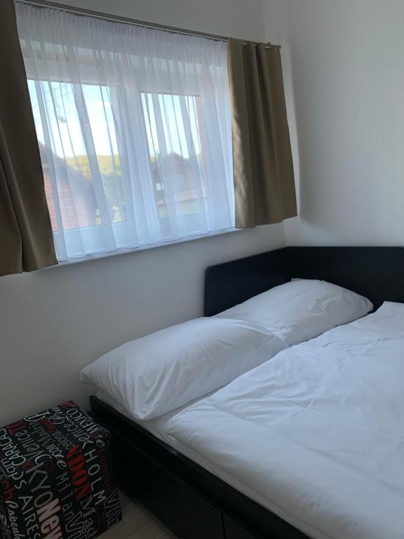 Postel nebo postele na pokoji v ubytování Apartmány Valča