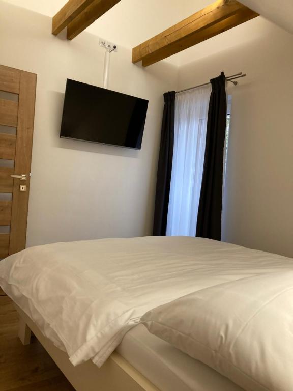 Postel nebo postele na pokoji v ubytování Apartmány Valča