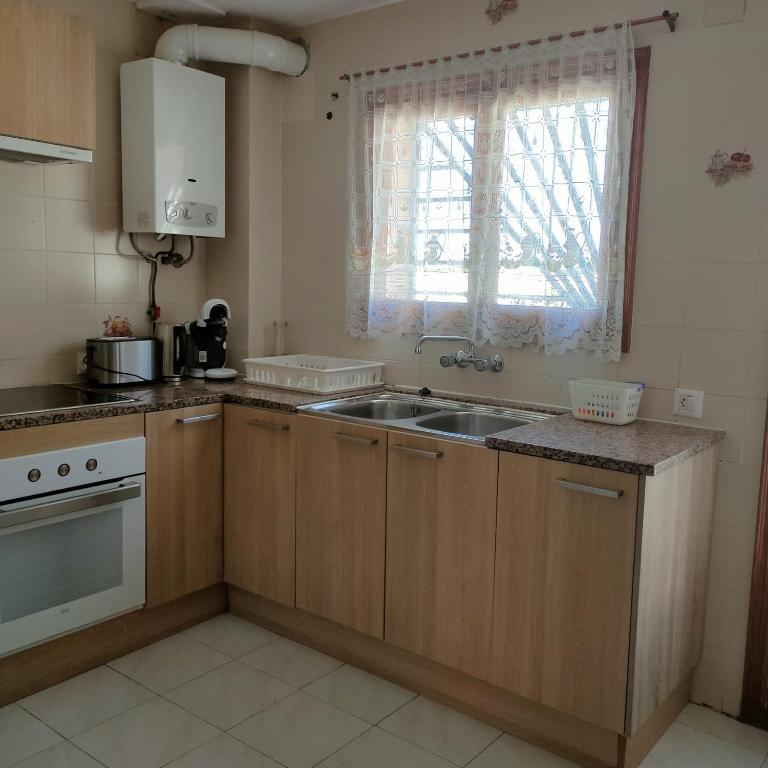 A kitchen or kitchenette at Casa Dorada