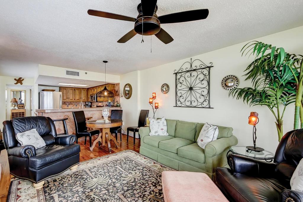 a living room with a couch and a ceiling fan at Wellington 304 in Myrtle Beach