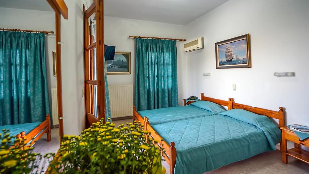Postel nebo postele na pokoji v ubytování Effie Hotel