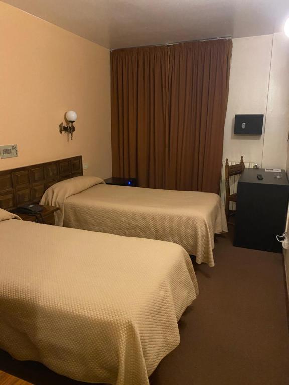 Postel nebo postele na pokoji v ubytování Hotel Folch