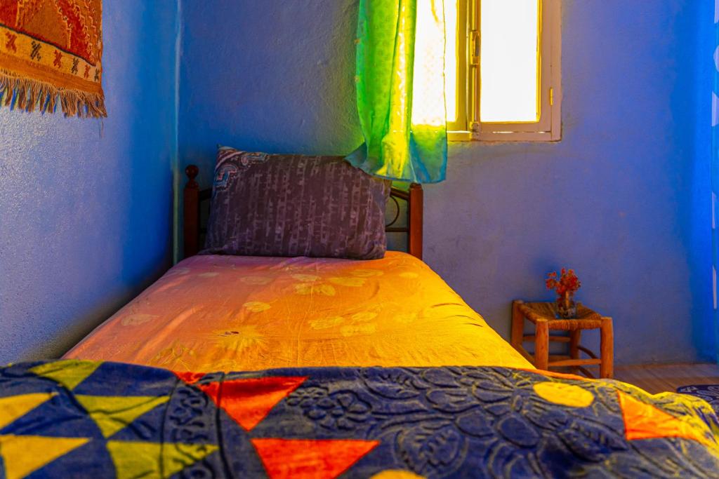 Postel nebo postele na pokoji v ubytování Auberge Aain Nakhla