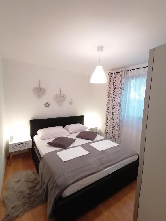 Posteľ alebo postele v izbe v ubytovaní Apartments and rooms with parking space Crikvenica - 12305