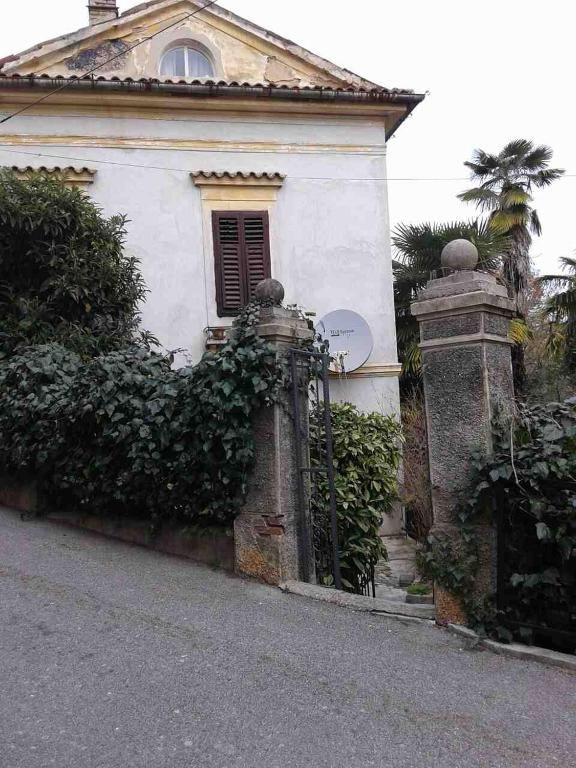 a house with a gate in front of it at Apartments with WiFi Opatija - 12426 in Opatija