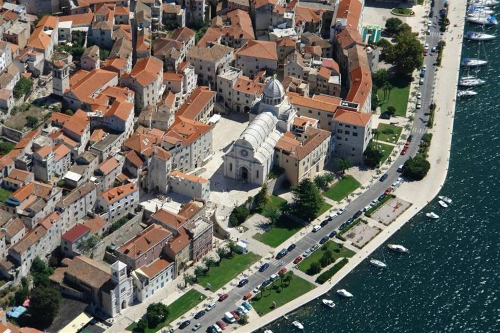 an aerial view of a city next to the water at Apartments by the sea Sibenik - 12454 in Šibenik