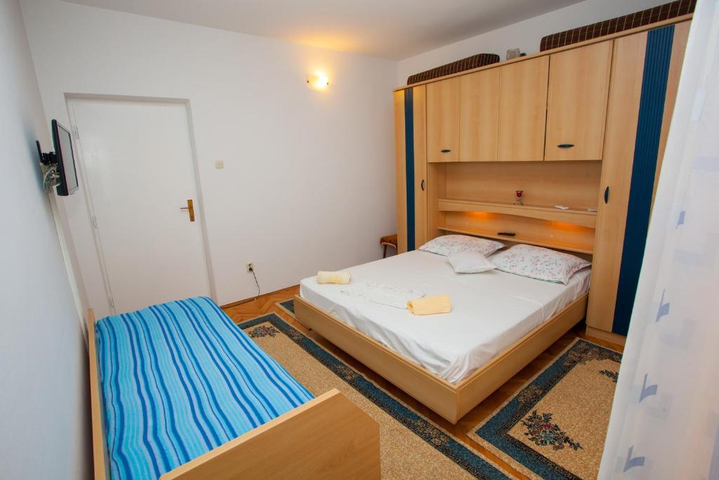 Posteľ alebo postele v izbe v ubytovaní Studio Podgora 12816a