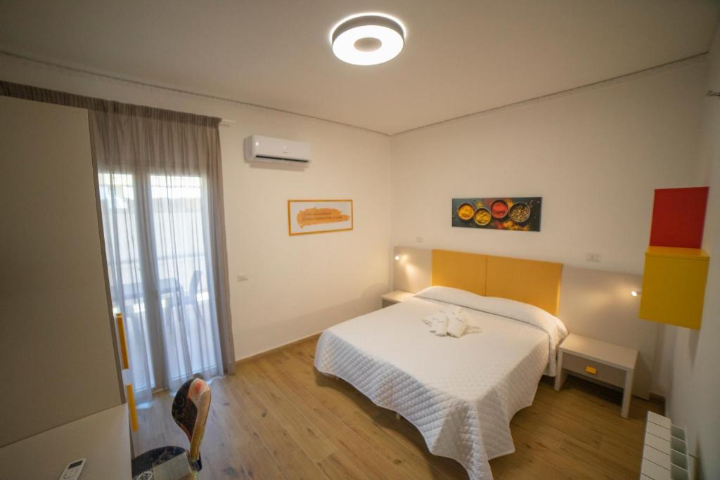 Posteľ alebo postele v izbe v ubytovaní Medoro Camere Milazzo