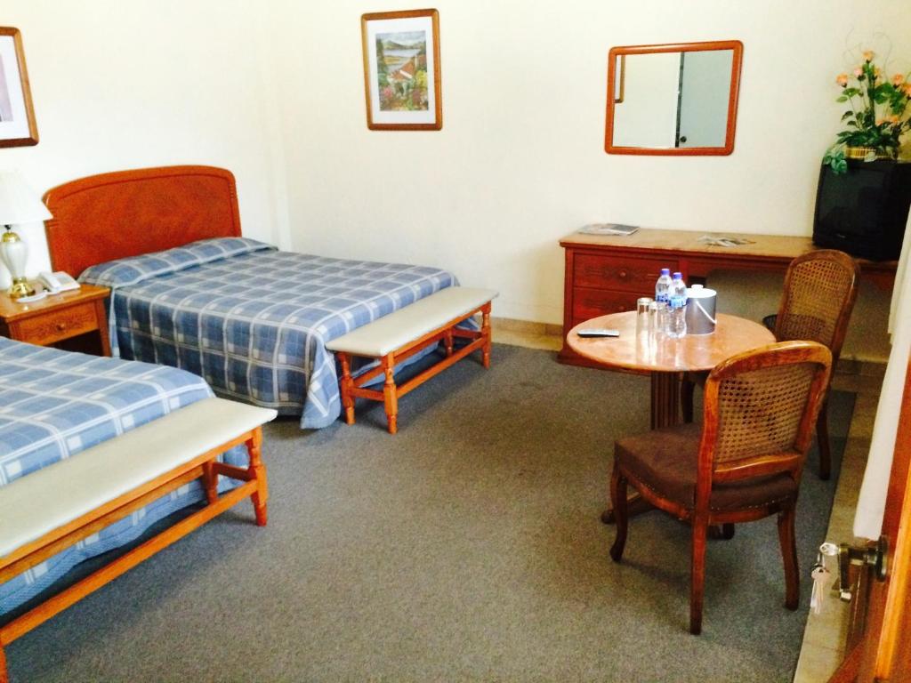 Postel nebo postele na pokoji v ubytování Villa Caltengo