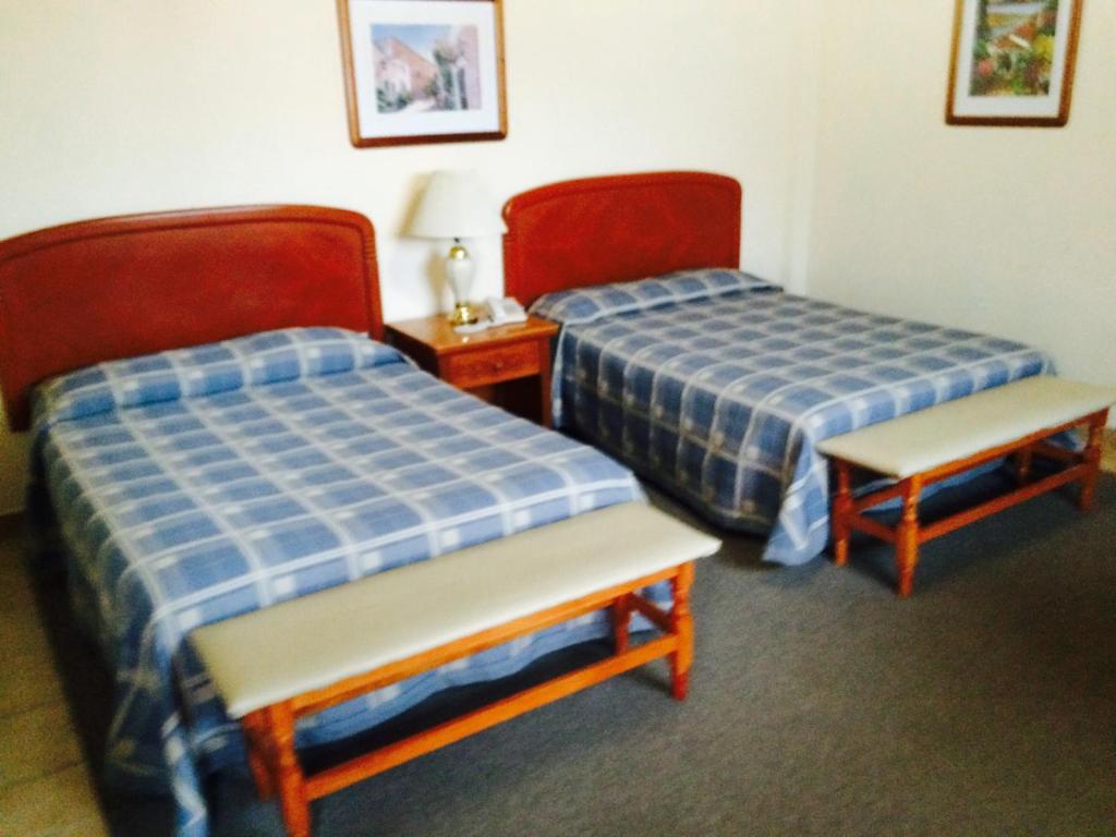 Postel nebo postele na pokoji v ubytování Villa Caltengo