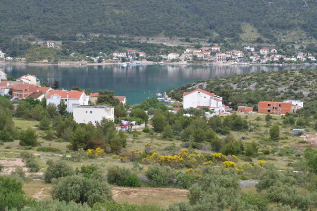 a view of a town and a body of water at Apartments with a parking space Grebastica, Sibenik - 13365 in Bašelovići