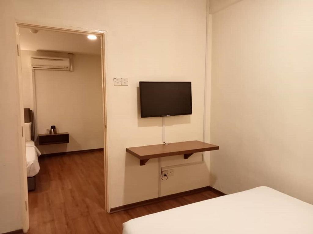 TV a/nebo společenská místnost v ubytování I Harmony Hotel