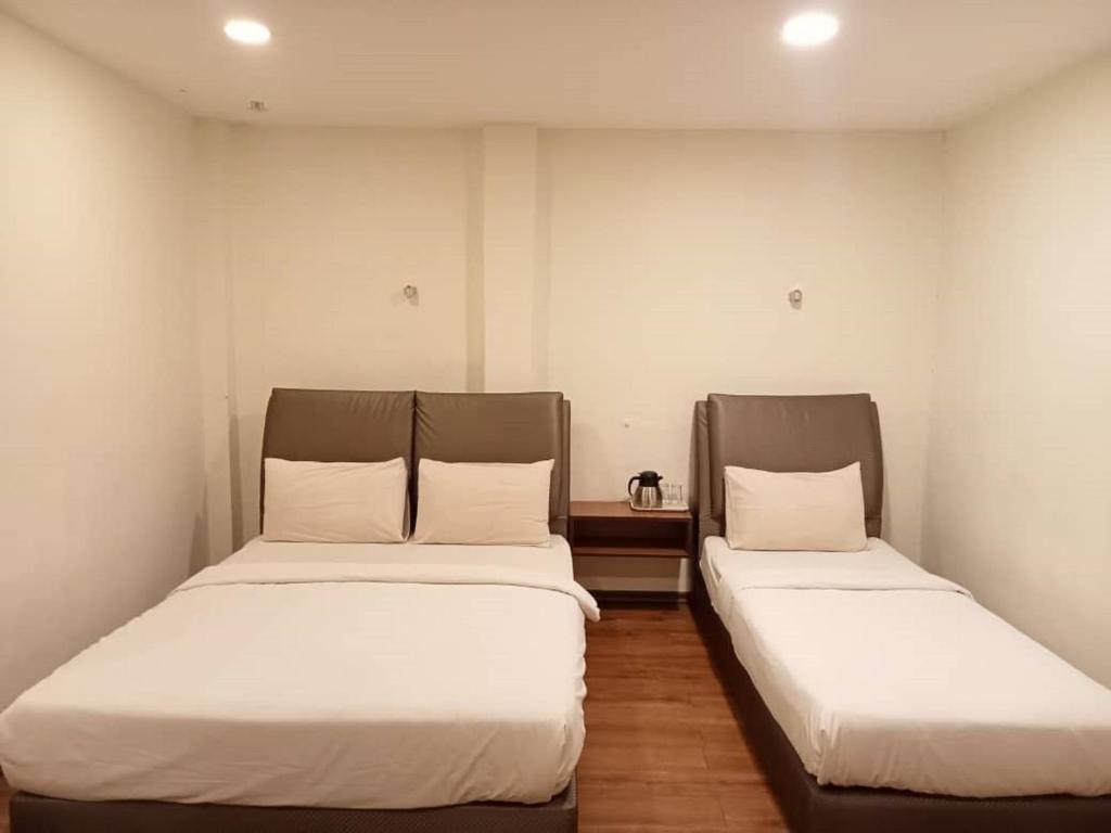 Postel nebo postele na pokoji v ubytování I Harmony Hotel