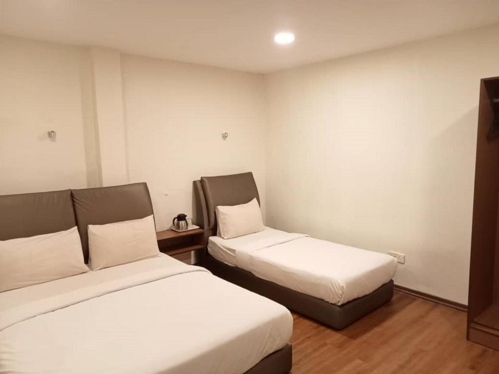 Postel nebo postele na pokoji v ubytování I Harmony Hotel