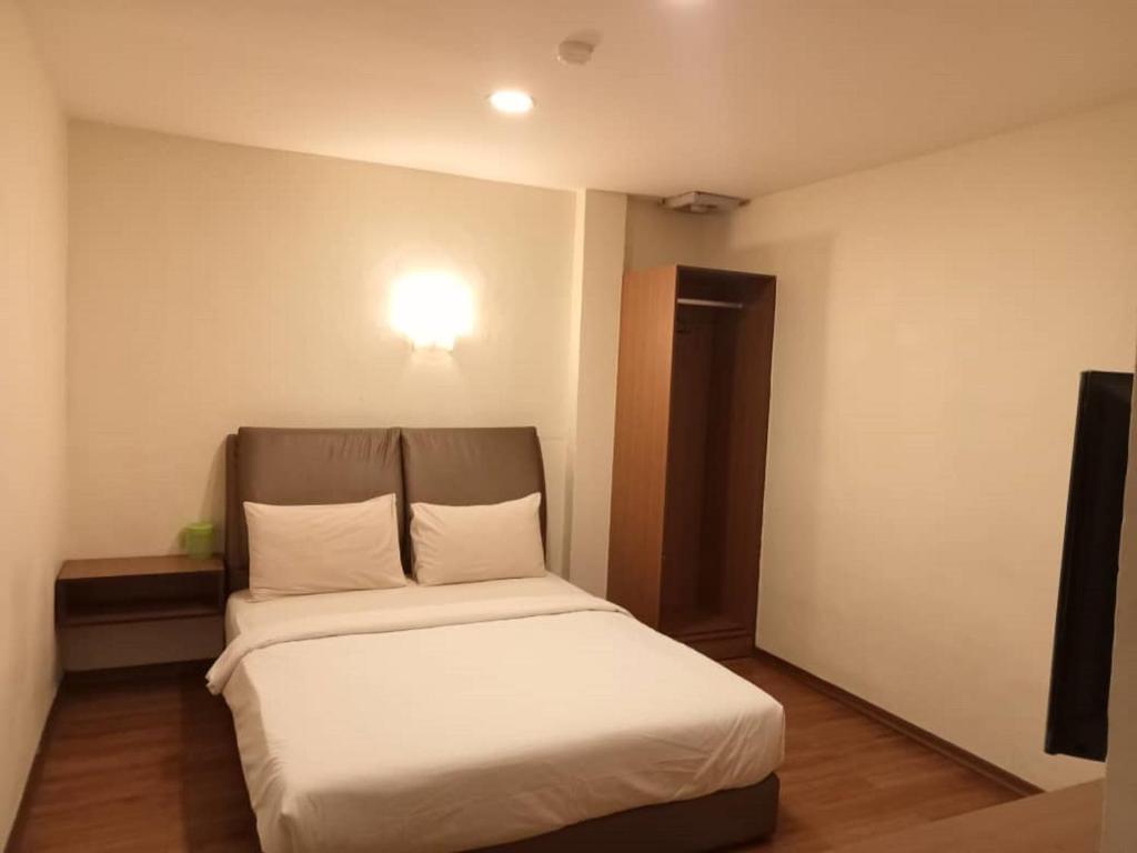 Postel nebo postele na pokoji v ubytování I Harmony Hotel