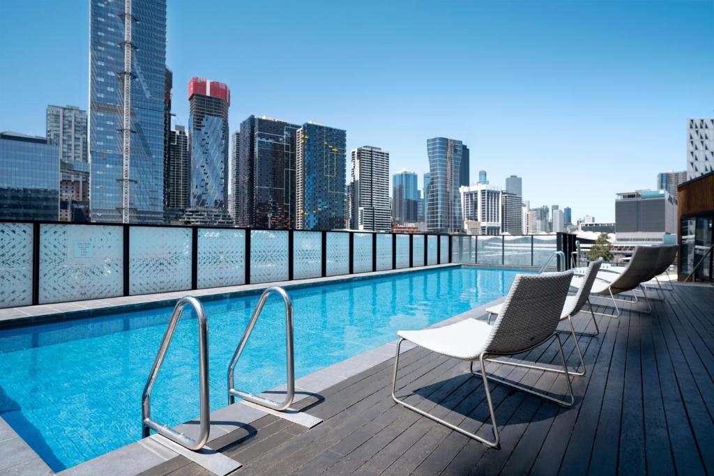 a swimming pool on the roof of a building at Peppers Docklands in Melbourne