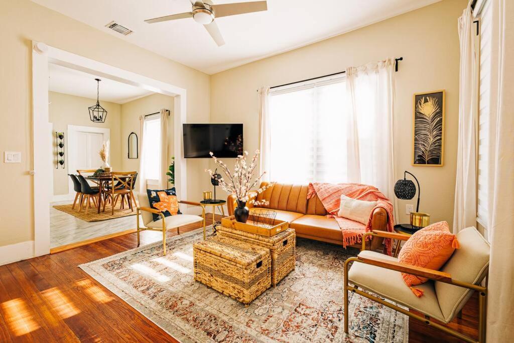 a living room with a couch and a table at Happy Halliday-6 Min from Downtown San Antonio,TX in San Antonio