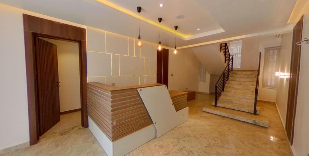 a room with a staircase and a room with a door at CENTURION APARTMENTS JABI ANNEX in Abuja