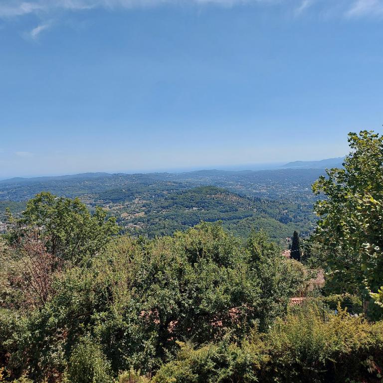 a view from the top of a hill with trees at Appartement cosy vue mer in Magagnosc
