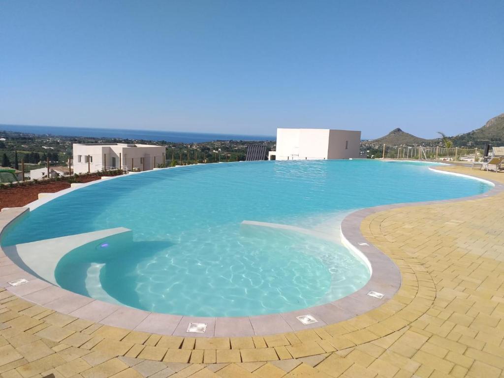 a large swimming pool on top of a building at Villa Cristina - Relax - Piscina e Vista Mare in Castellammare del Golfo