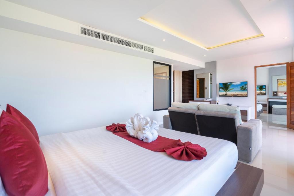 Postel nebo postele na pokoji v ubytování Paripas Patong Resort