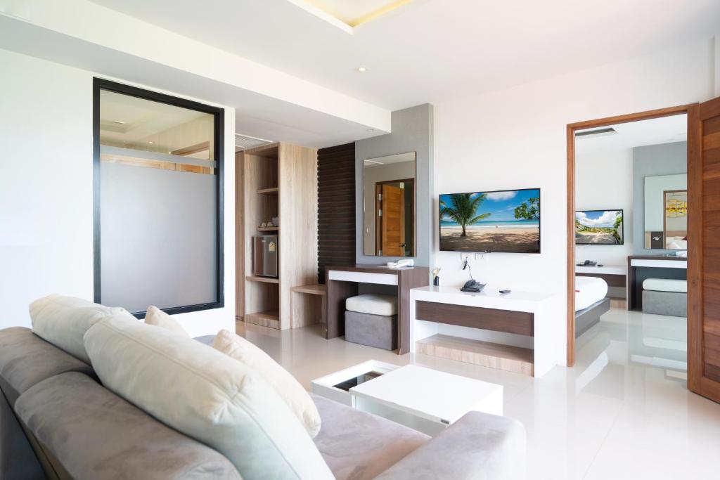 Postel nebo postele na pokoji v ubytování Paripas Patong Resort