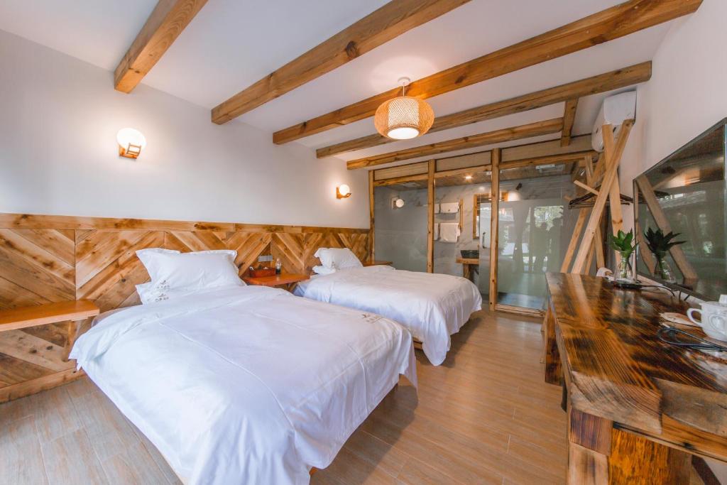 Postel nebo postele na pokoji v ubytování Swallow Nest Guesthouse