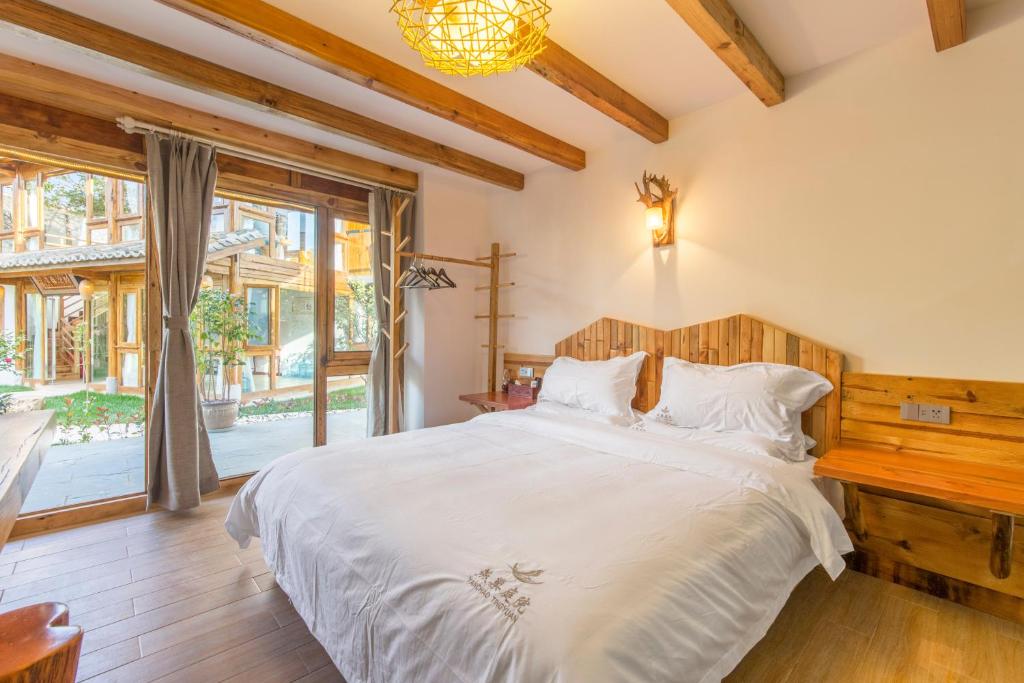 Postel nebo postele na pokoji v ubytování Swallow Nest Guesthouse