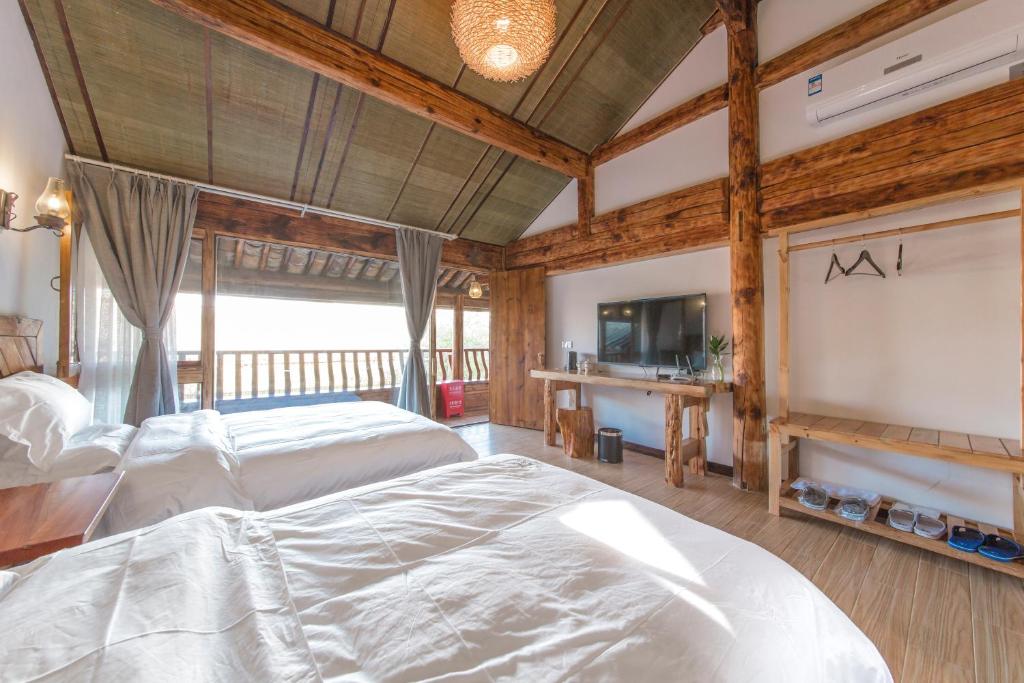 Postel nebo postele na pokoji v ubytování Swallow Nest Guesthouse