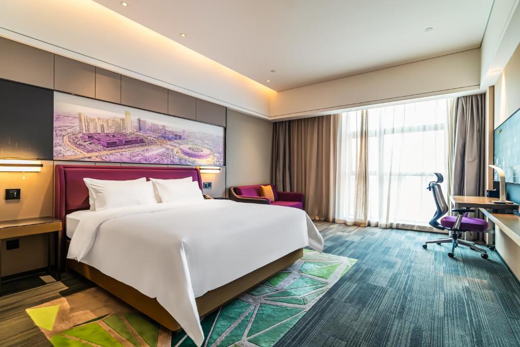 TV a/nebo společenská místnost v ubytování 佛山敏卓酒店Mentor Hotel