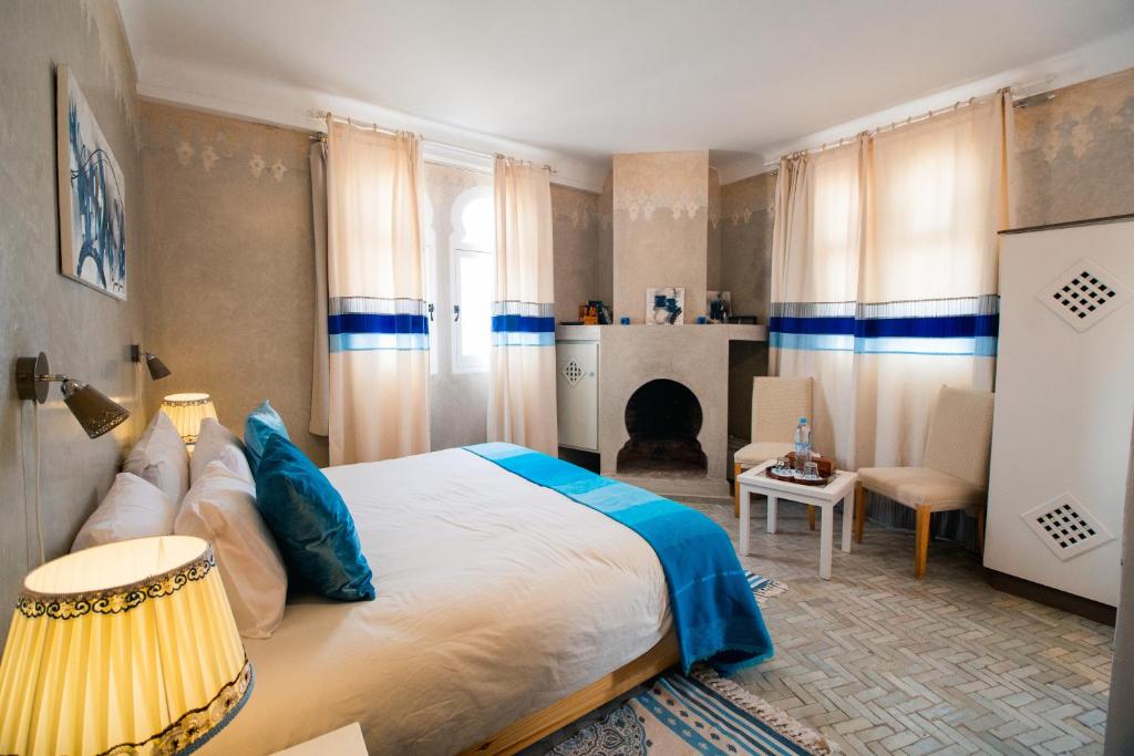 Postel nebo postele na pokoji v ubytování Dar Liouba Hotel