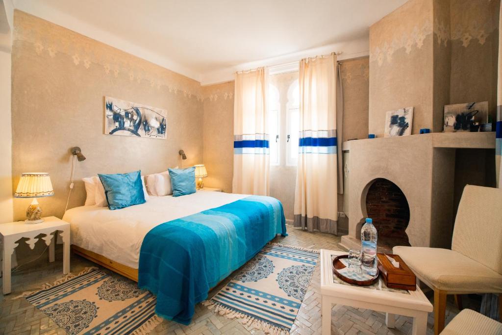Postel nebo postele na pokoji v ubytování Dar Liouba Hotel